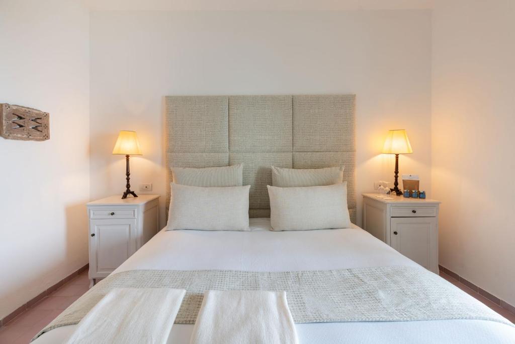 Postel nebo postele na pokoji v ubytování Santavenere Hotel