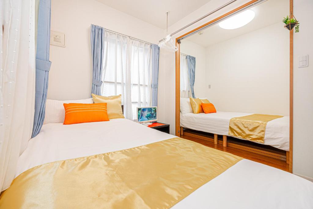 Een bed of bedden in een kamer bij close KYARA HOTEL 亀戸201