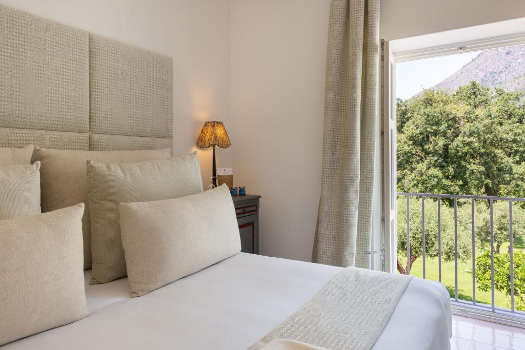 Postel nebo postele na pokoji v ubytování Santavenere Hotel