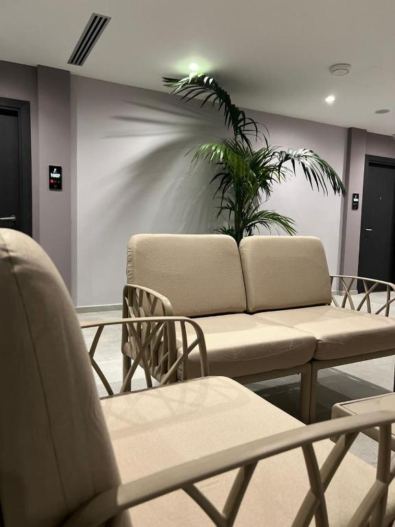 Posezení v ubytování Joelle Premium Hotel