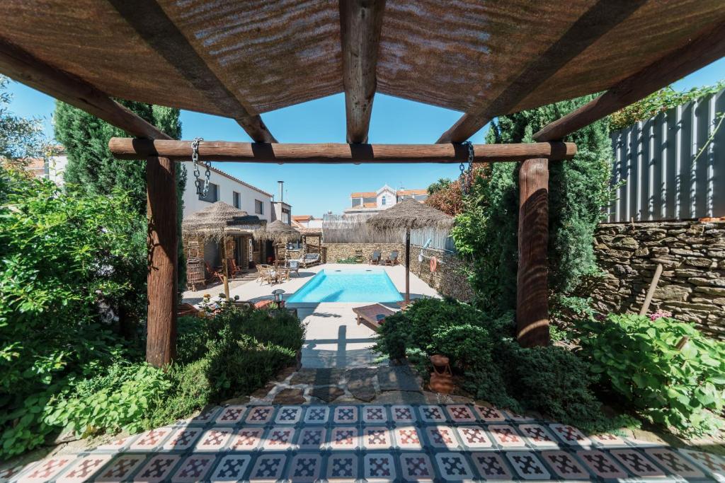 a view from the inside of a pavilion with a swimming pool at Feel Discovery Douro Janja in Armamar