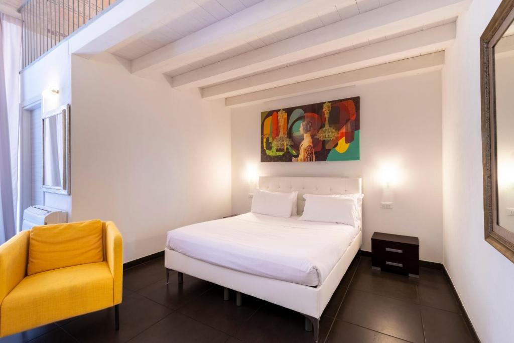 Postel nebo postele na pokoji v ubytování Palazzo Cavour