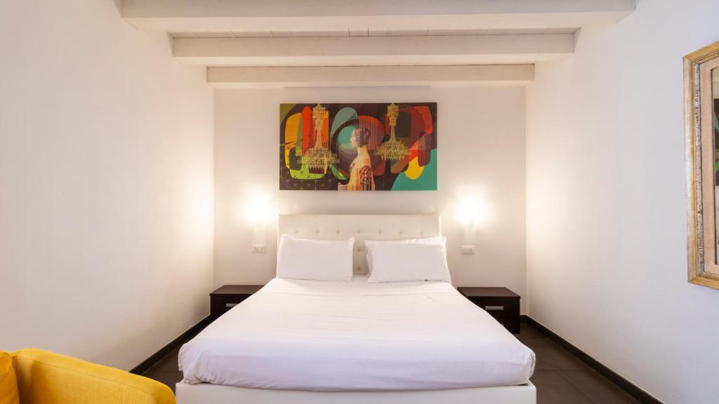 Postel nebo postele na pokoji v ubytování Palazzo Cavour