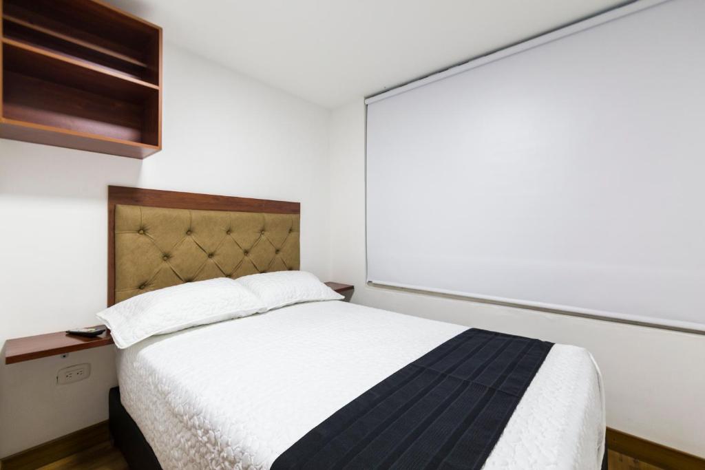 Hotel Casa Botero 102 tesisinde bir odada yatak veya yataklar