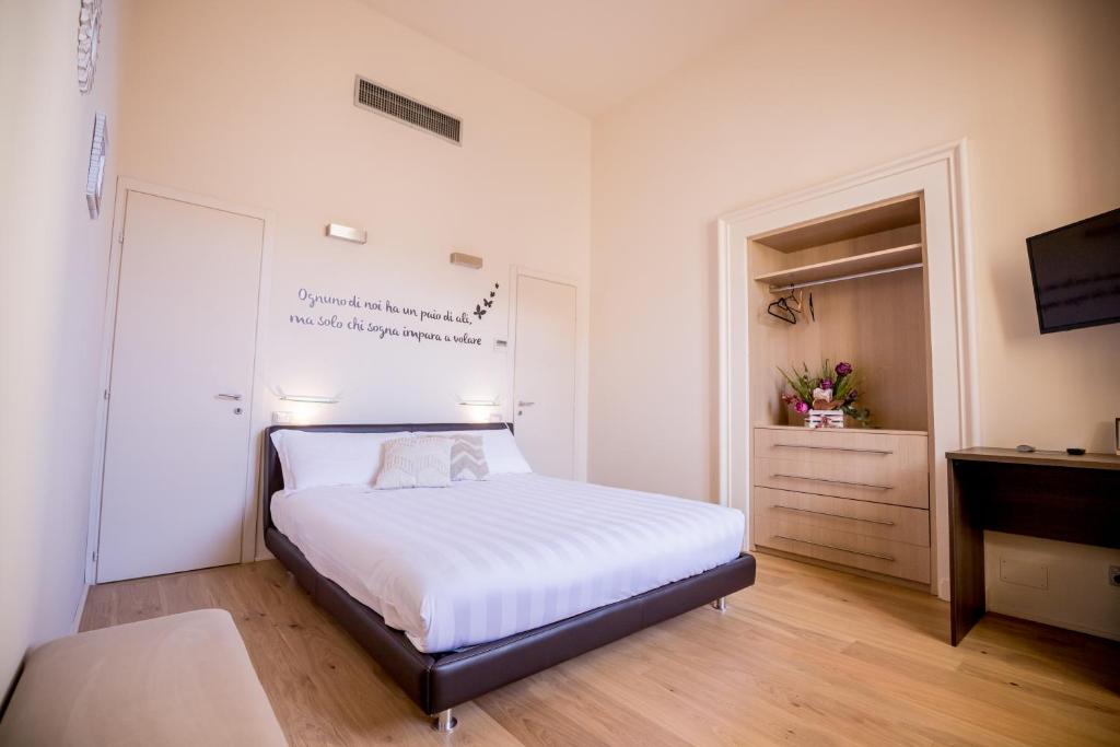 Postel nebo postele na pokoji v ubytování La Torre Rooms