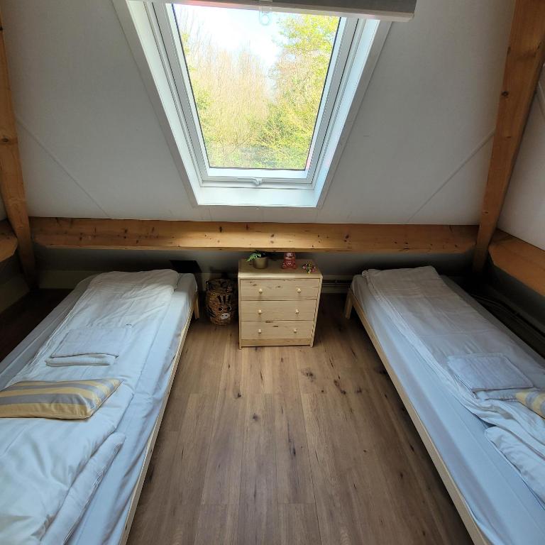Postel nebo postele na pokoji v ubytování Ecolodges De Dreef Guesthouse
