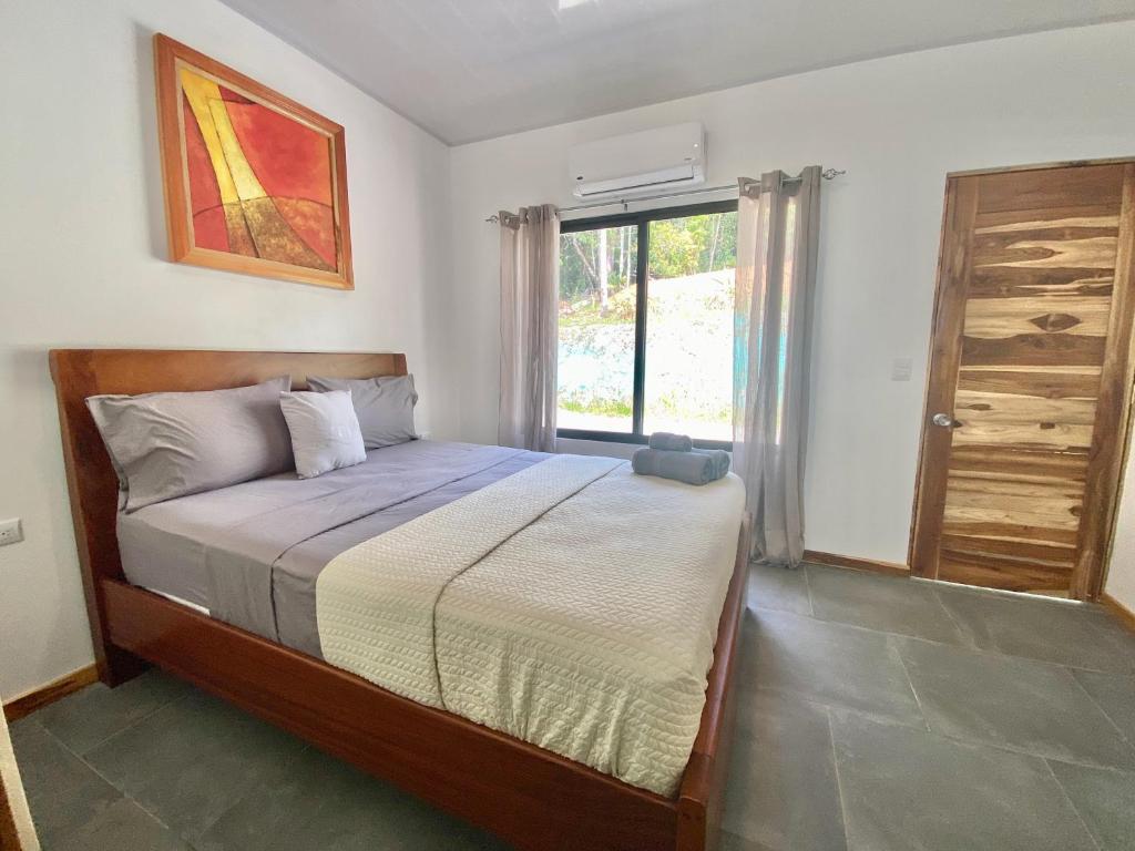 Postel nebo postele na pokoji v ubytování Canavida Villas & Resort