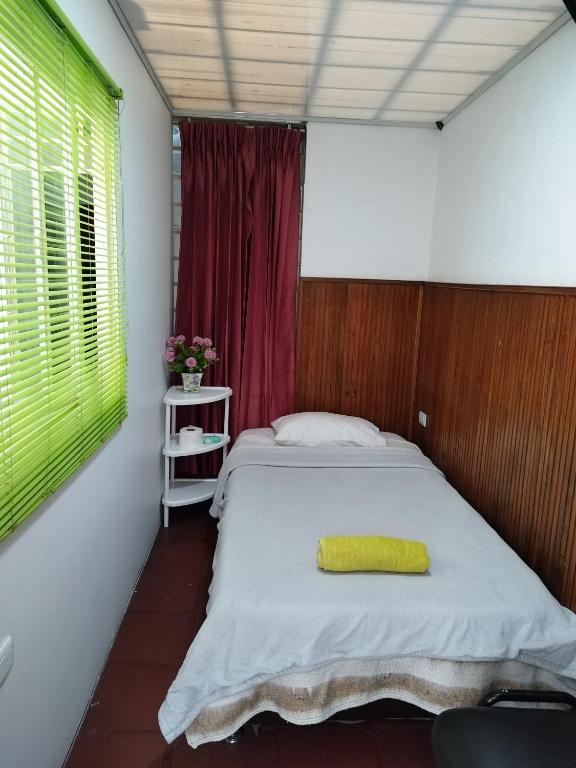 Postel nebo postele na pokoji v ubytování Casa en Bogotá ubicada en zona central