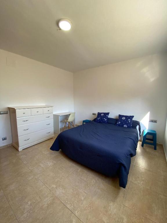 Postel nebo postele na pokoji v ubytování CAN TRULLEN CHALET CALAFELL