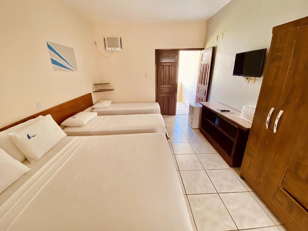 Postel nebo postele na pokoji v ubytování Hotel Porto das Ancoras