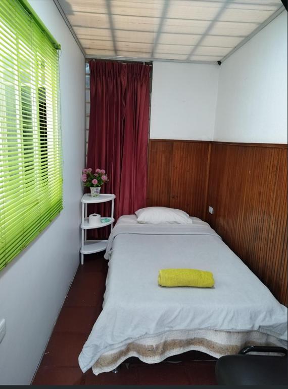 Postel nebo postele na pokoji v ubytování Casa en Bogotá ubicada en zona central