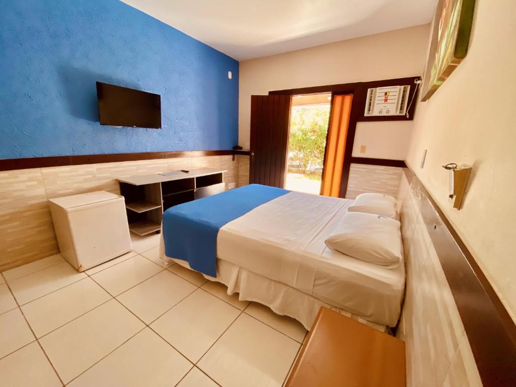 Postel nebo postele na pokoji v ubytování Hotel Porto das Ancoras
