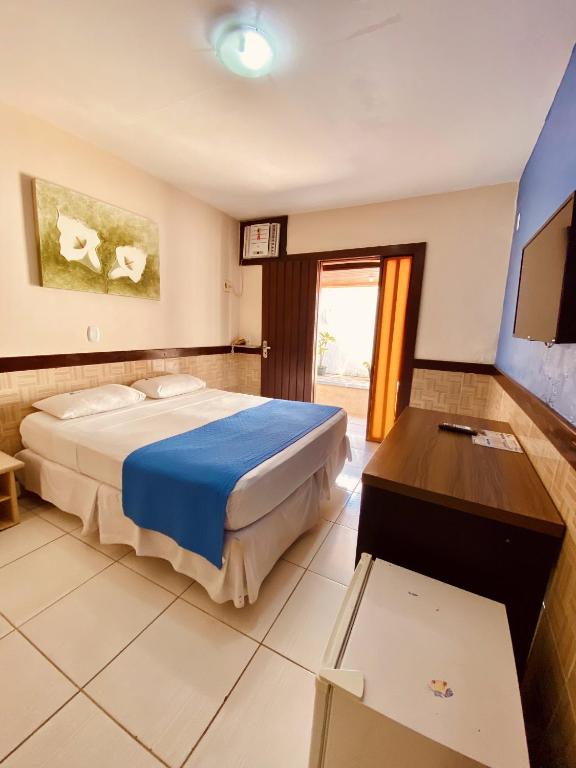 Postel nebo postele na pokoji v ubytování Hotel Porto das Ancoras