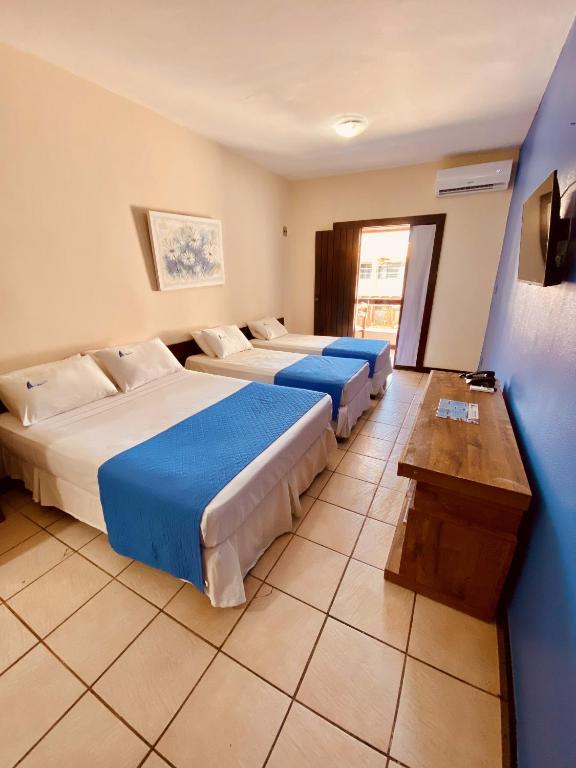 Postel nebo postele na pokoji v ubytování Hotel Porto das Ancoras
