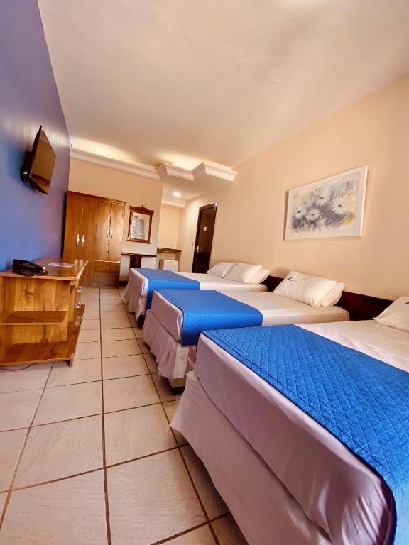Postel nebo postele na pokoji v ubytování Hotel Porto das Ancoras