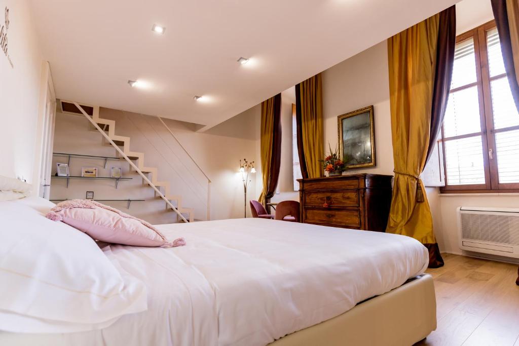 Postel nebo postele na pokoji v ubytování La Torre Rooms