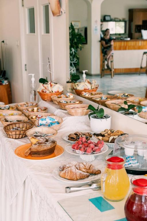 a table with many different types of food on it at Hotel Belvedere in Sperlonga