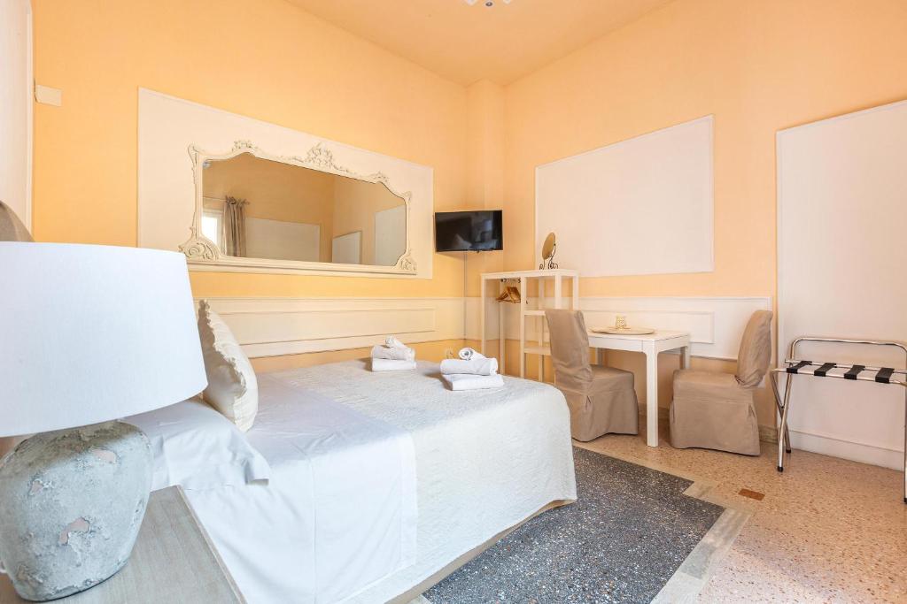 TV a/nebo společenská místnost v ubytování Dimora Le Tre Muse Guesthouse