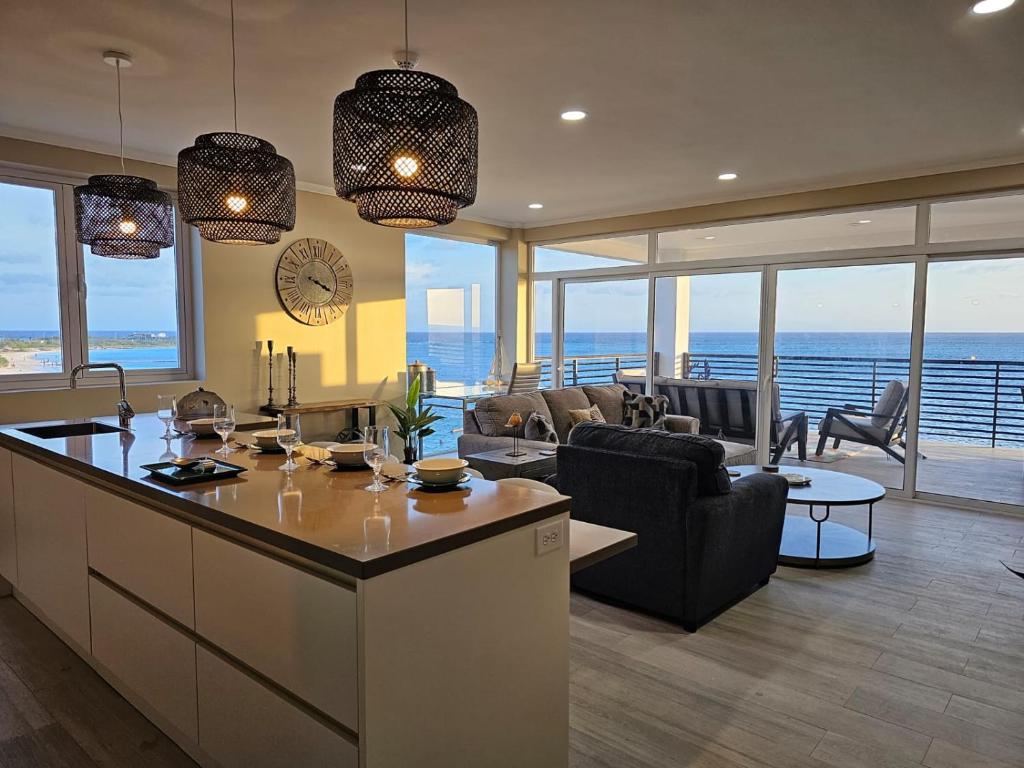 a kitchen and living room with a view of the ocean at Little bit of Heaven in Ceru Colorado