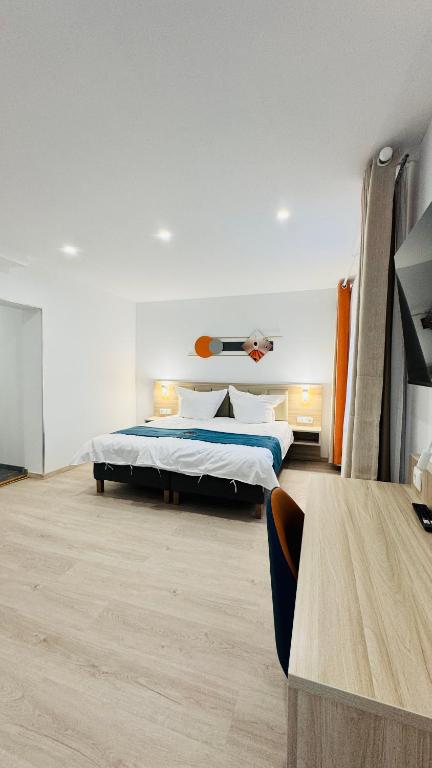 Postel nebo postele na pokoji v ubytování Hotel Libers