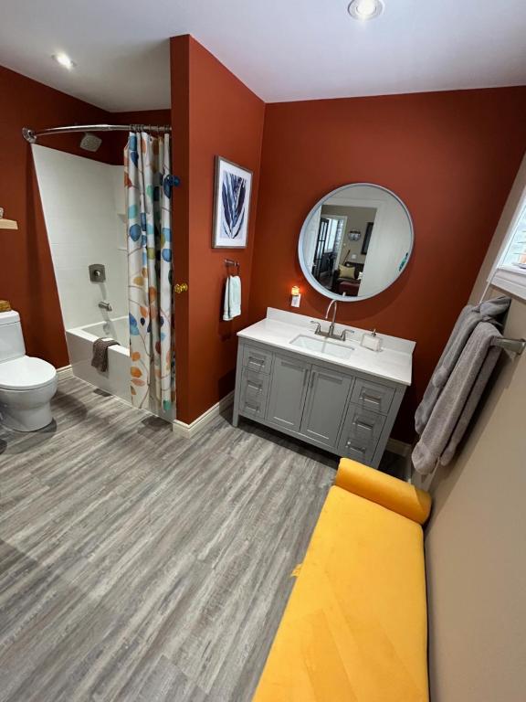 a bathroom with a sink and a mirror at The Inn on Bay in Gravenhurst