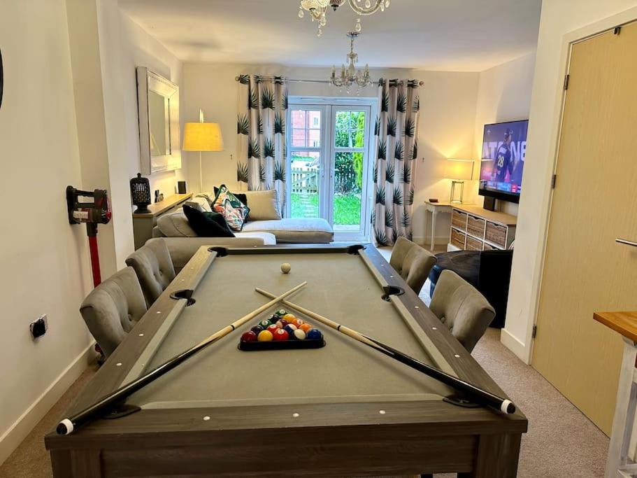 a living room with a pool table in it at 4BR Cheshire East/Townhouse/Central - Close to Bentley in Crewe