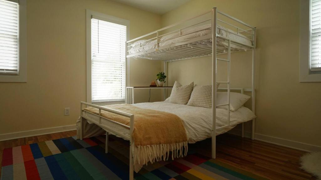 a bedroom with a canopy bed in a room at Beautiful Home Central Columbus in Columbus