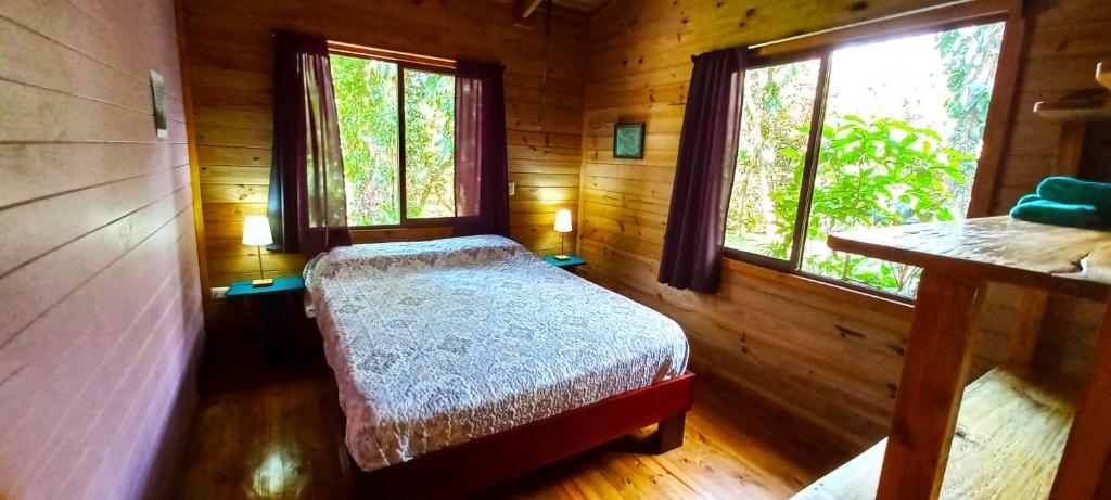Postel nebo postele na pokoji v ubytování Cabinas Costa Tropicana