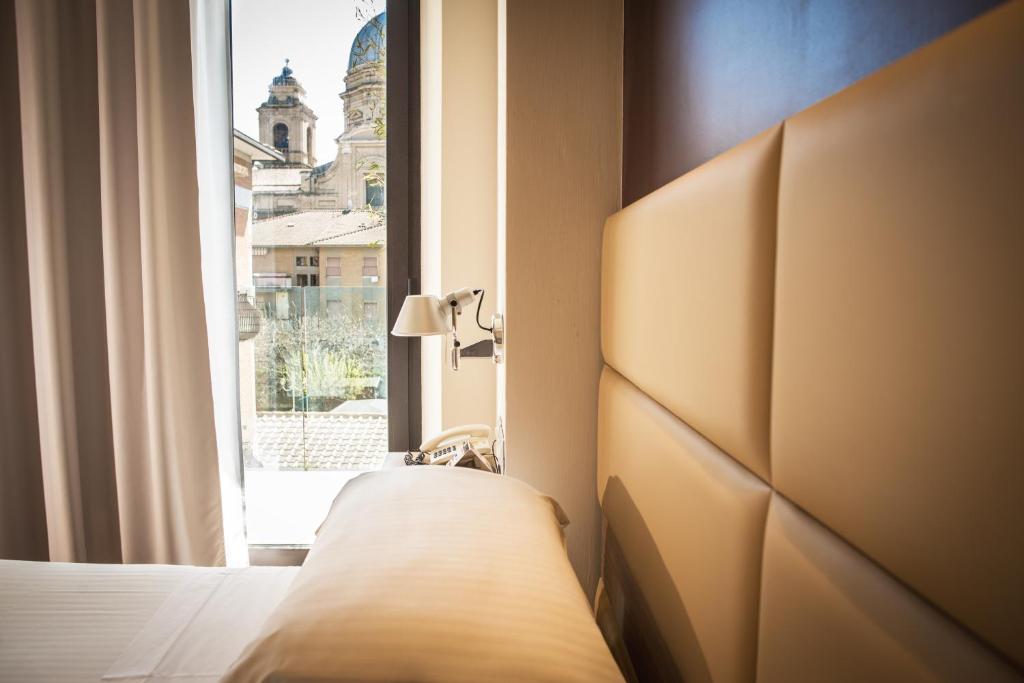 Cama ou camas em um quarto em Dal Moro Gallery Hotel