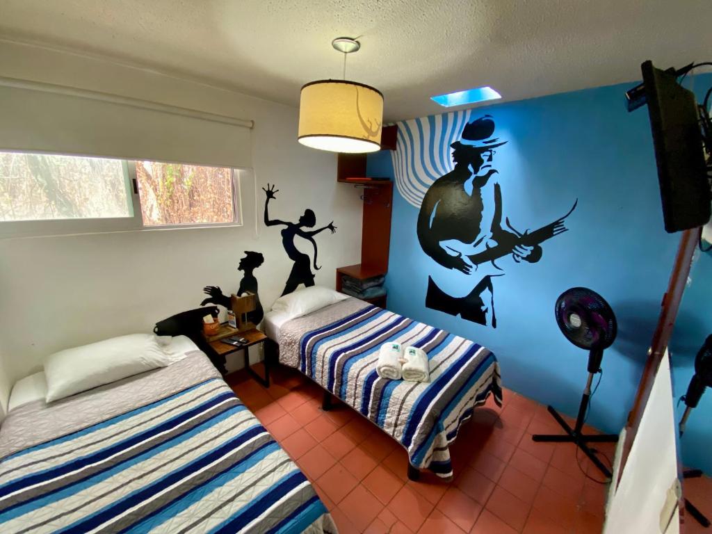 Postel nebo postele na pokoji v ubytování Hostel Hospedarte Chapultepec