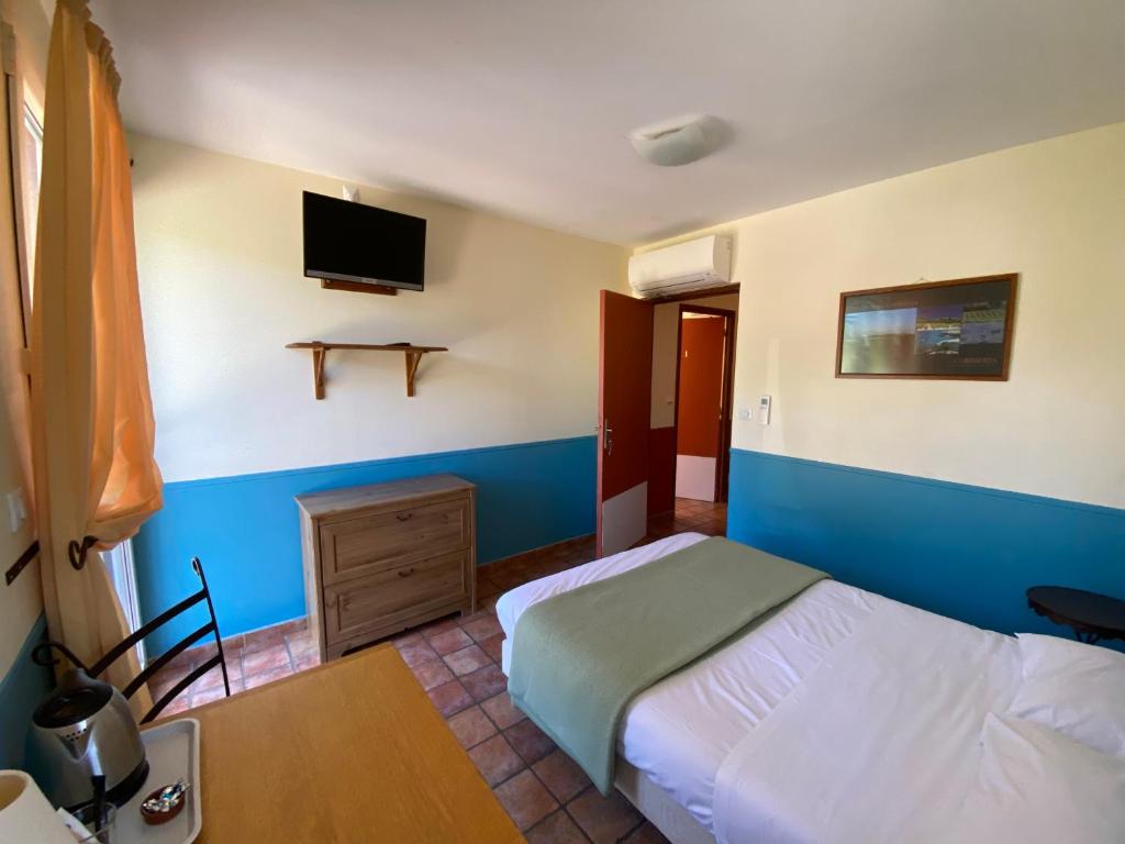 Postel nebo postele na pokoji v ubytování Auberge la Table du Curé