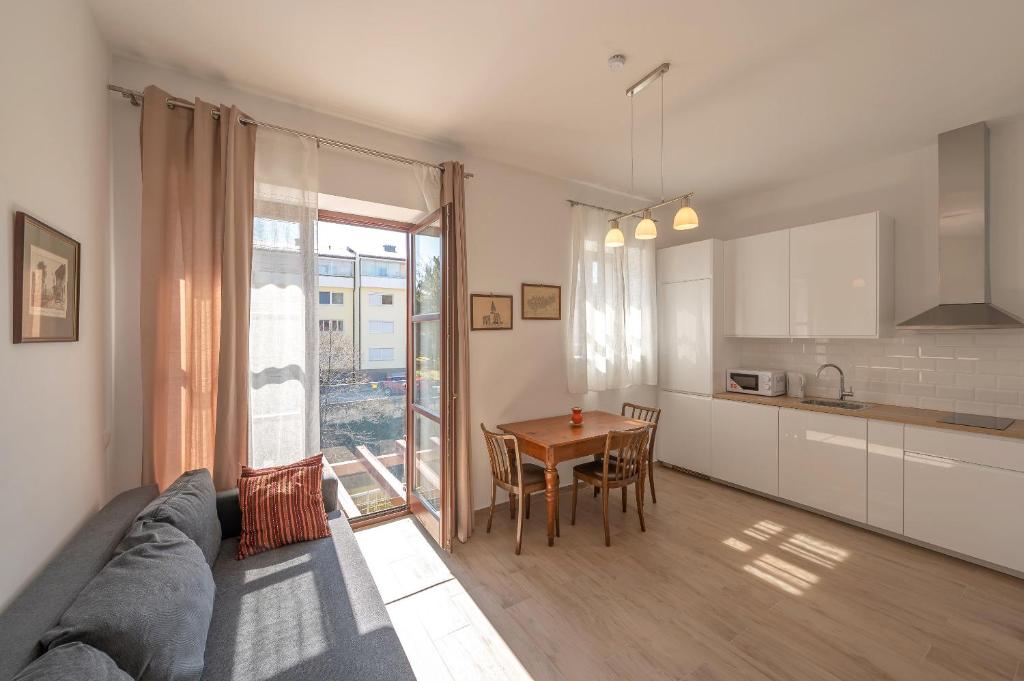 a living room with a couch and a table at Villa Musik - Historical apartments in Baden in Baden