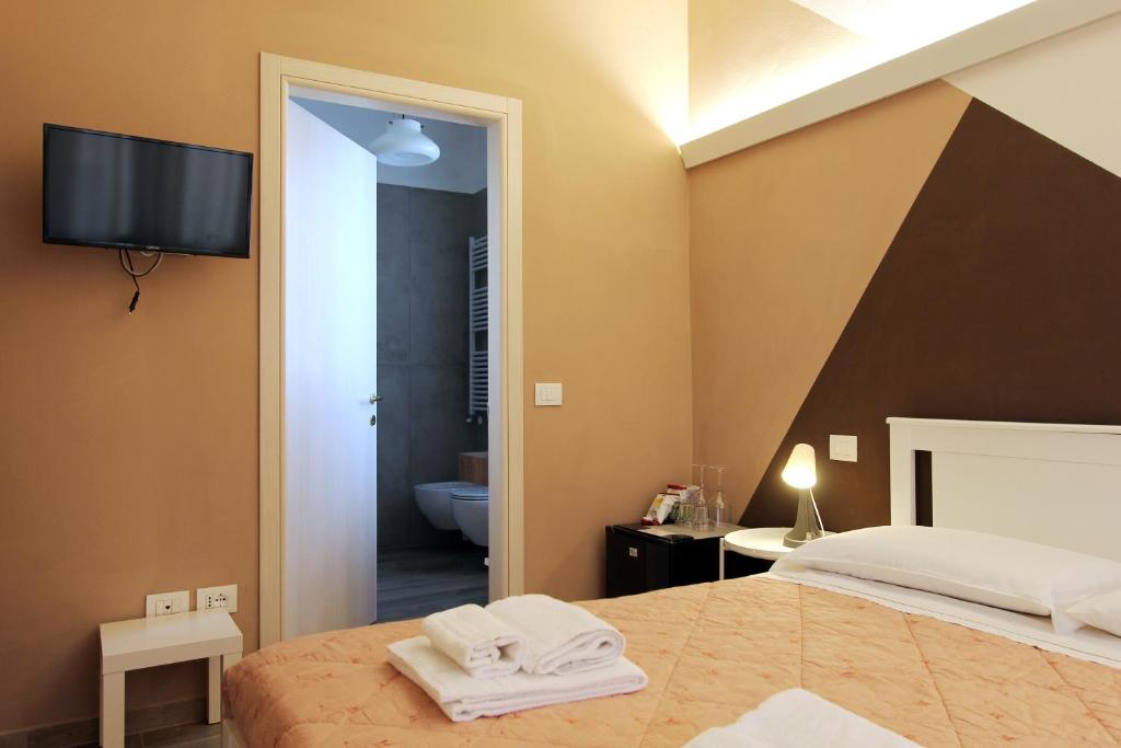 Postel nebo postele na pokoji v ubytování Maison N&M