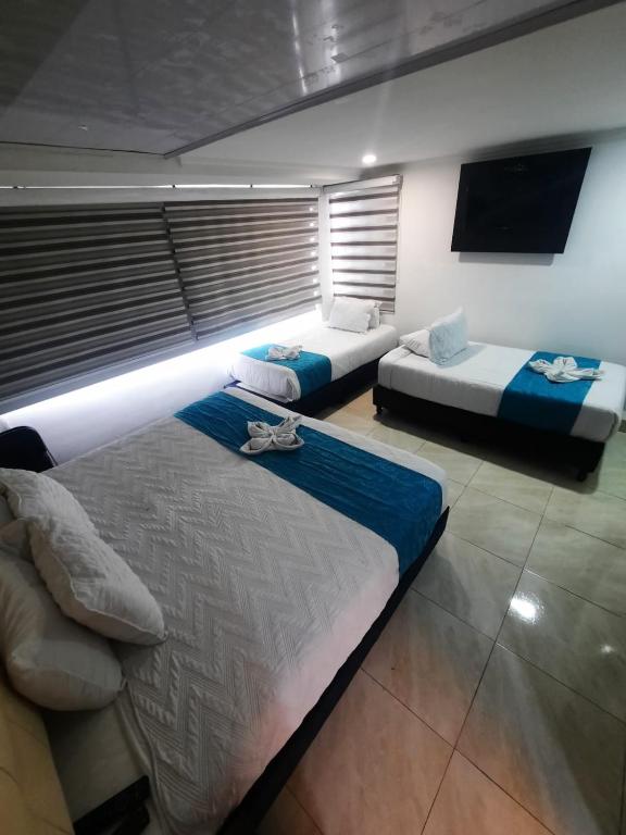 Postel nebo postele na pokoji v ubytování Hotel Zafiro Boutique