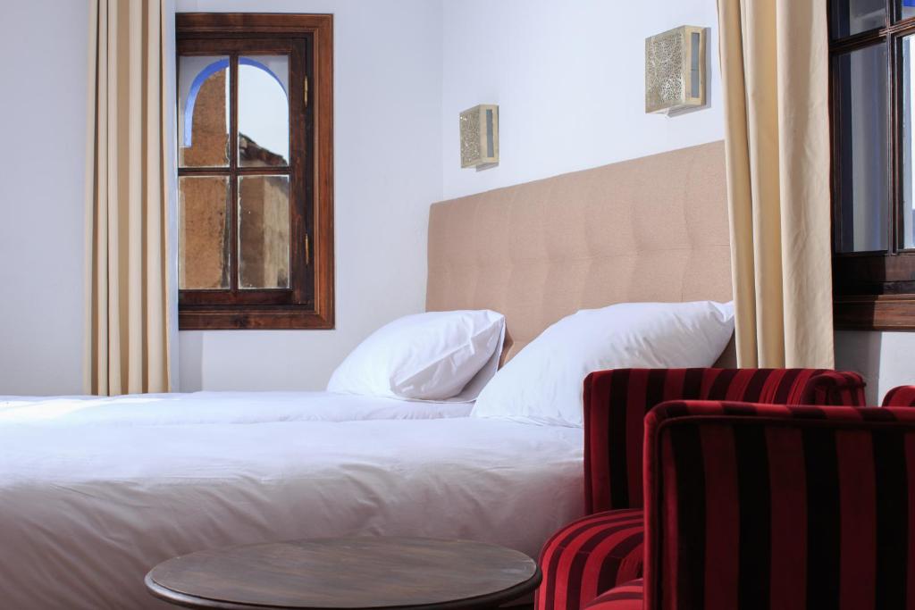 Postel nebo postele na pokoji v ubytování Riad Zaitouna Chaouen