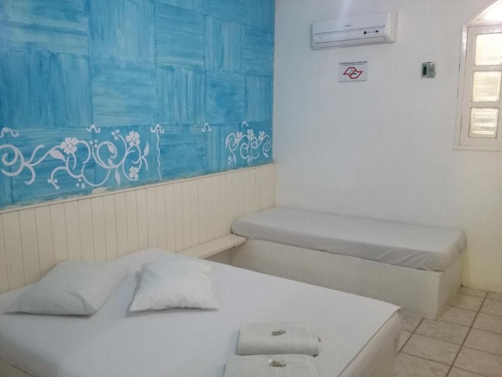 Postel nebo postele na pokoji v ubytování Pousada Pé de Caju