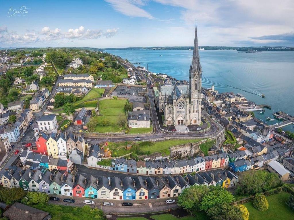 an aerial view of a town with a church and water at Sea view Flat Cobh in Cobh