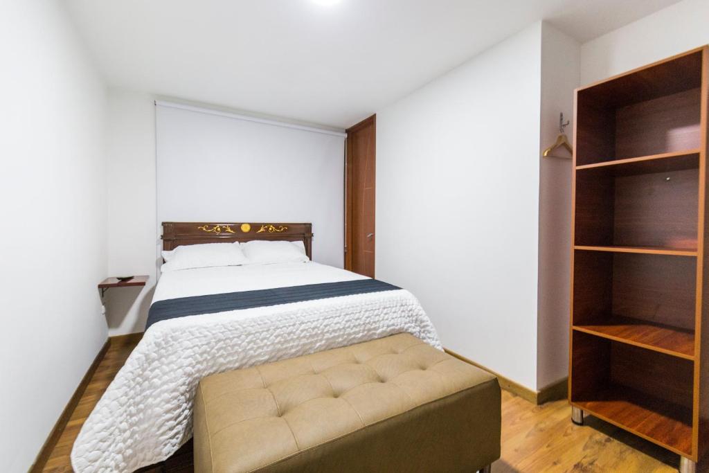 Postel nebo postele na pokoji v ubytování Hotel Casa Botero 203