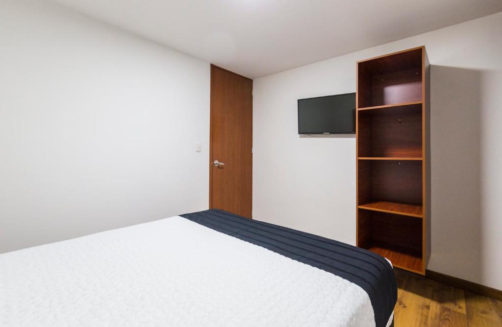 TV a/nebo společenská místnost v ubytování Hotel Casa Botero 204