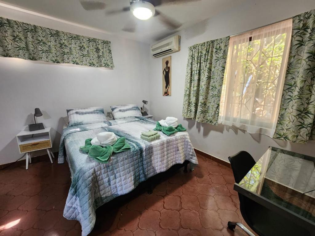 Postel nebo postele na pokoji v ubytování Villas Pura Vibra