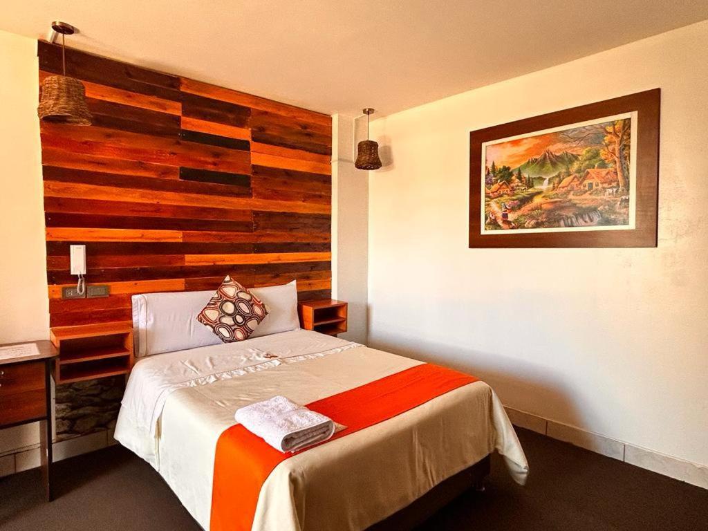 Cama o camas de una habitación en Hotel Plaza Central