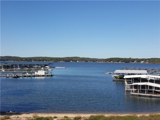 a large body of water with a bunch of docks at Beach House Sleep 20 with VIP pkg, Bachelor Parties Welcomed in Lake Ozark