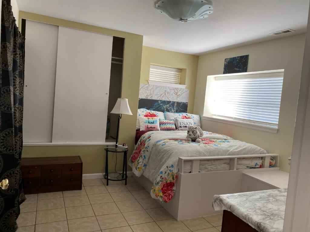 a bedroom with a bed with a stuffed animal on it at CALM Retreat and Event Center in Auburn