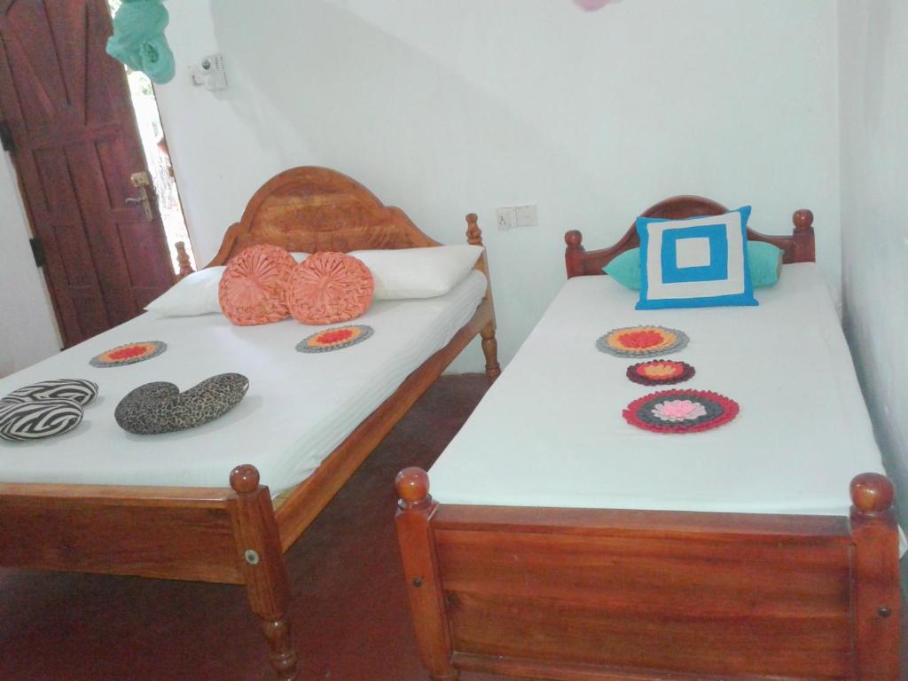 Postel nebo postele na pokoji v ubytování Lak Nilla Guest House