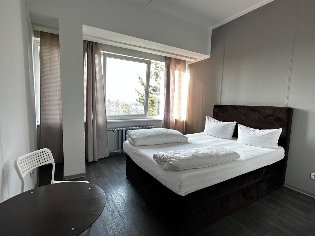 Postel nebo postele na pokoji v ubytování Ootel.com