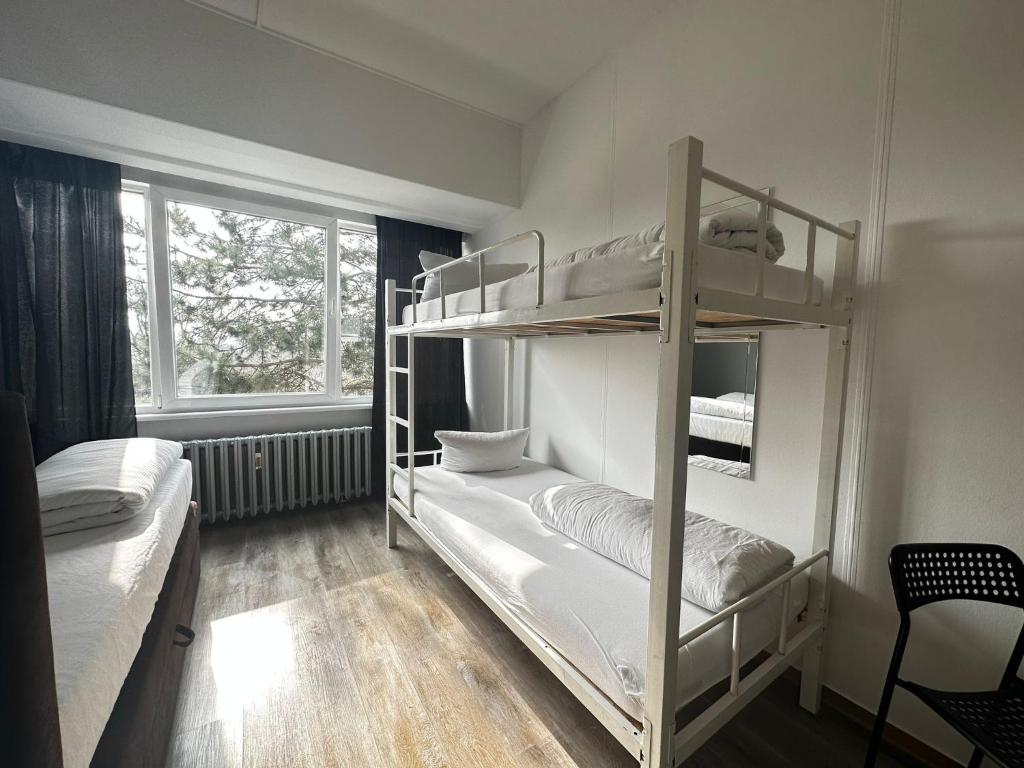 Postel nebo postele na pokoji v ubytování Ootel.com