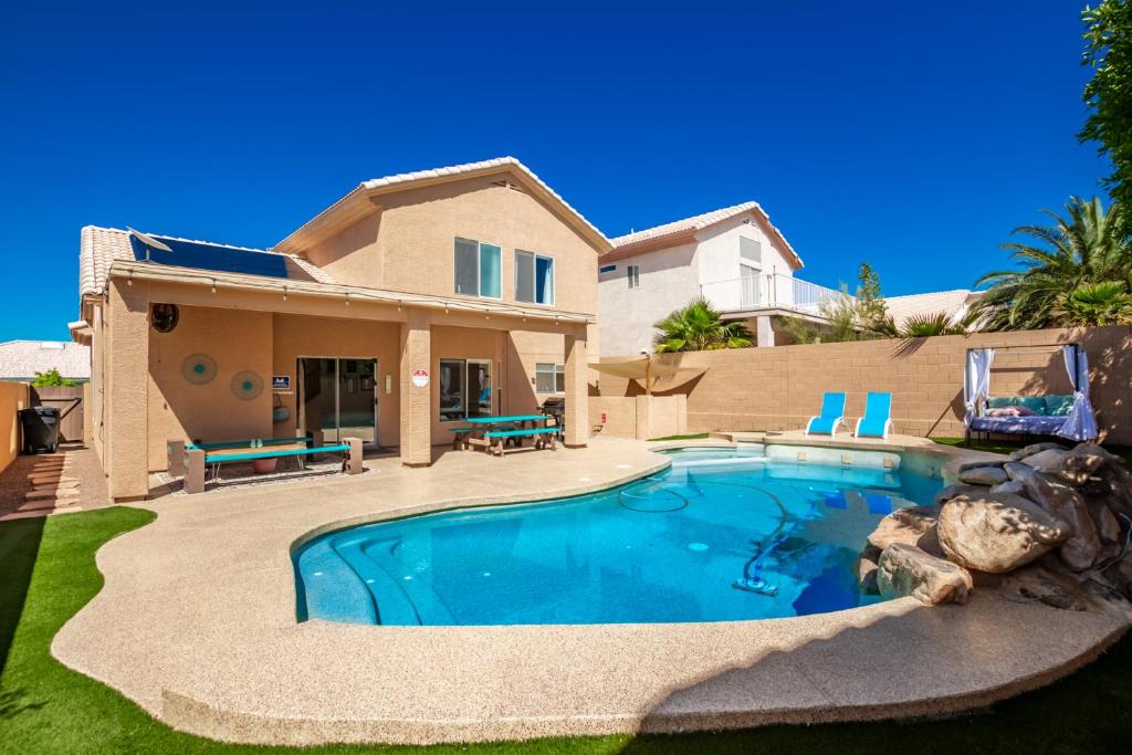 a house with a swimming pool in the yard at Rejuvenate Yourself at this Arizona Home in Scottsdale
