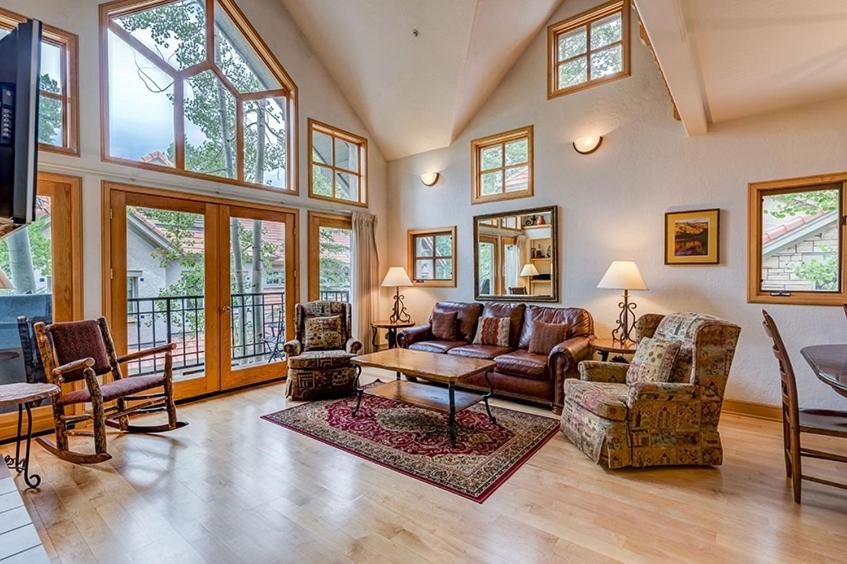 a large living room with a couch and chairs at Aspen Ridge 32 - 2 bedroom townhouse in Telluride