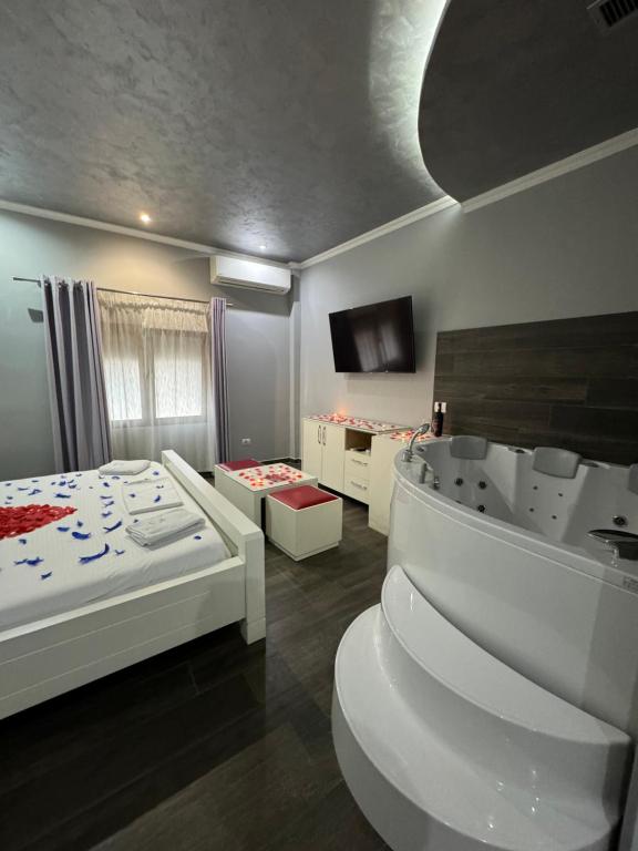 Postel nebo postele na pokoji v ubytování Imperium Hotel
