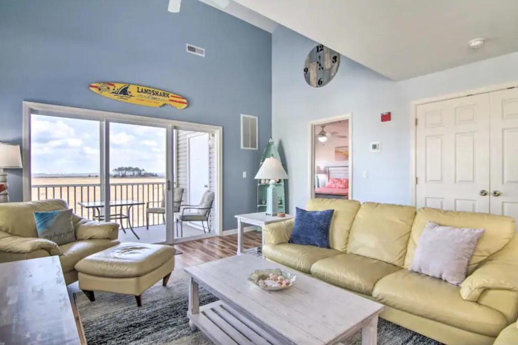 a living room with a couch and a table at Bethany Bay - 37434 Pettinaro Dr #4805 in Ocean View